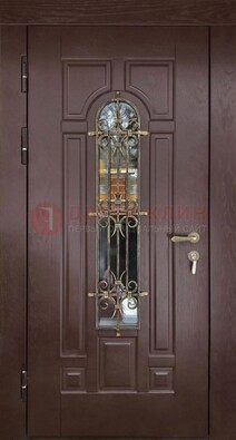 Темная железная дверь со стеклом и ковкой для частного дома ДСК-156 в Фрязино